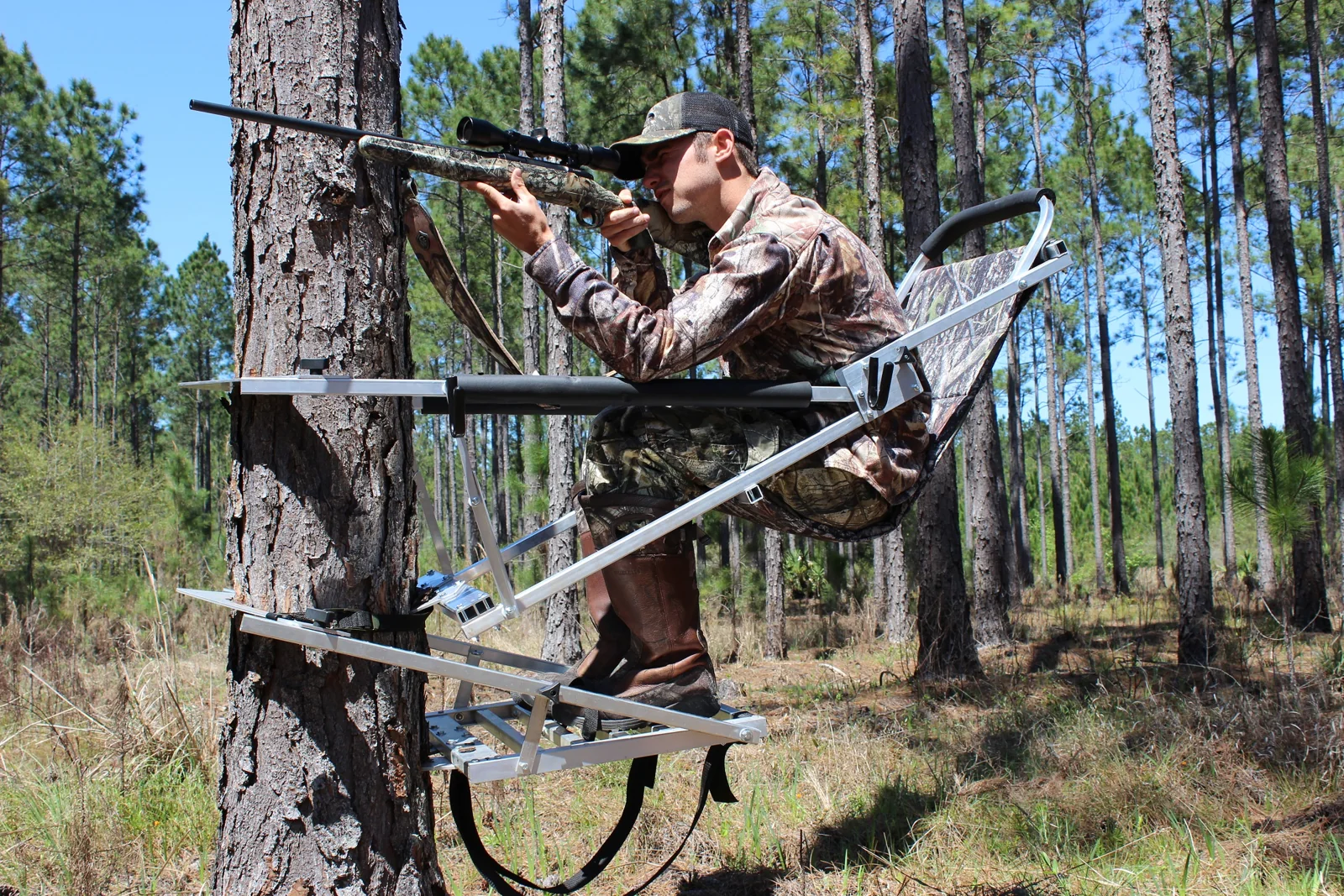 Hunter aiming a rifle while seated in The Gunslinger